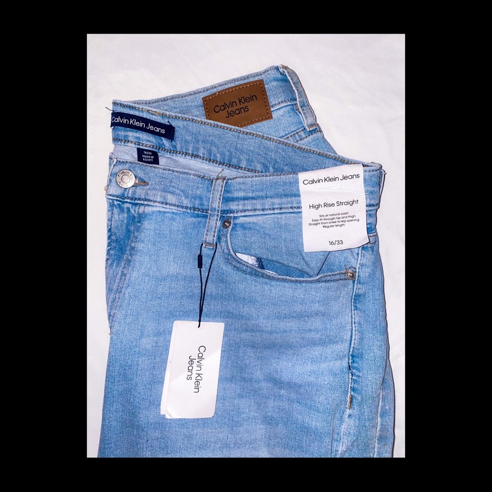 light blue Calvin Klein 16/33 high rise straight jeans w/distressing